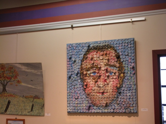 Art created with bottle caps and corks.